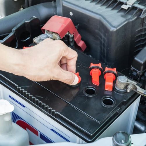 Car-Battery-Being-Worked-On-for-Car-Maintenance Car-Battery-Being-Worked-On-for-Car-Maintenance